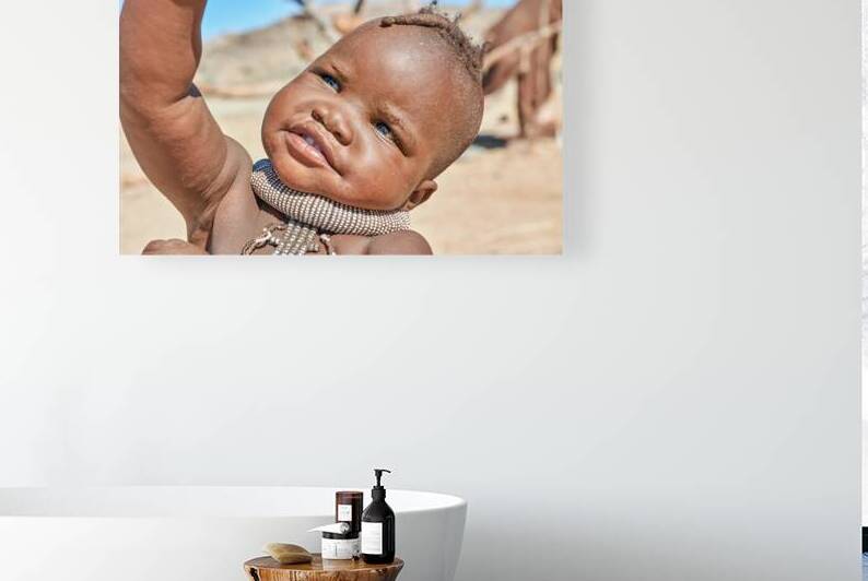 Portrait of Himba child in Kunene region of Namibia by Marco Brivio