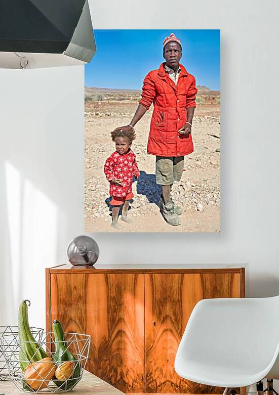 Father and daughter stand together in Palmwag Kunene Region by Marco Brivio