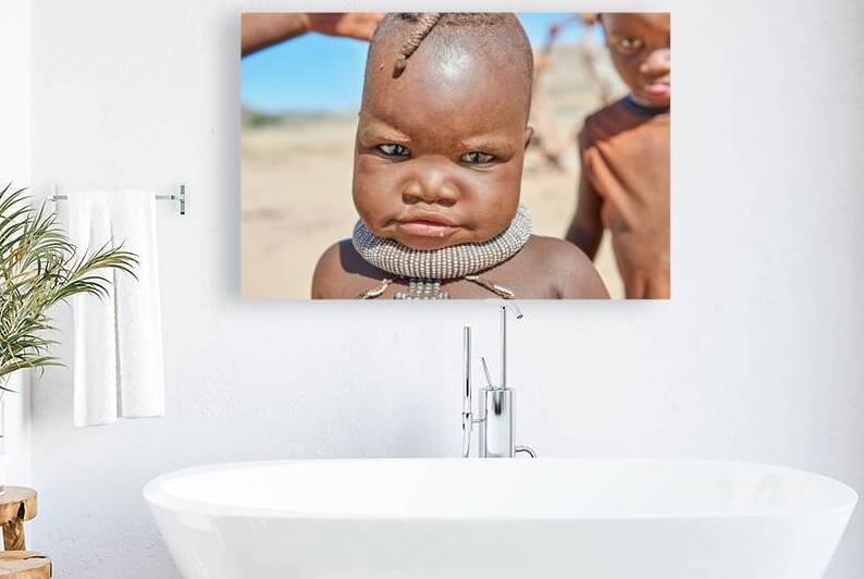 Portrait of Himba child in Kunene region of Namibia by Marco Brivio
