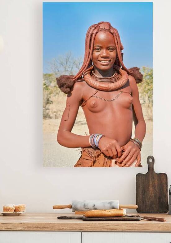Himba woman poses in Kunene region of Namibia during sunny day by Marco Brivio