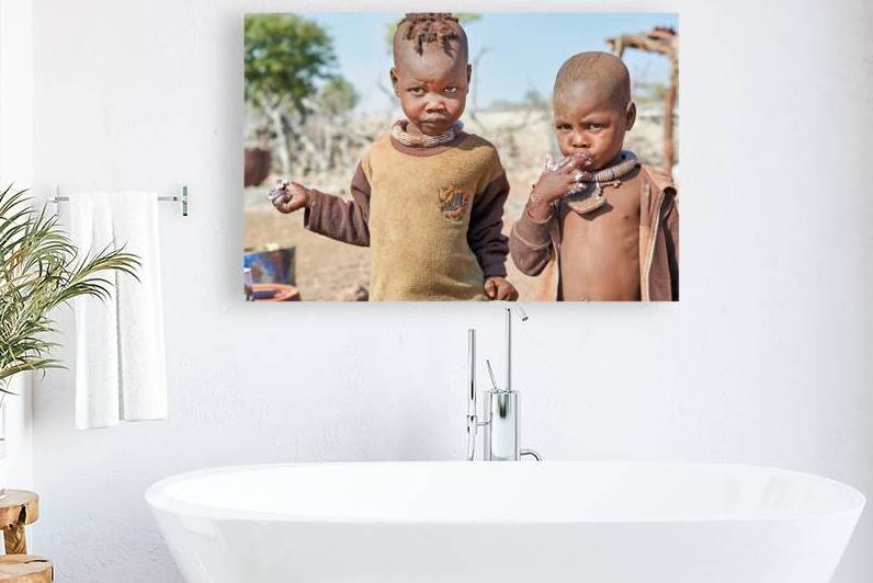 Children playing in Himba village in Kunene Region of Namibia by Marco Brivio