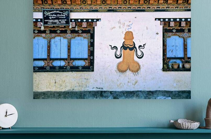 Phallus painting on a building wall with windows and shop sign. by Marco Brivio