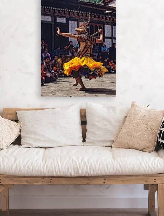 Bhutanese masked deer dancer performs for an attentive audience. by Marco Brivio