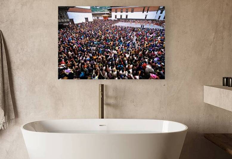 Bhutanese festival: crowd watches traditional dance in monastery by Marco Brivio