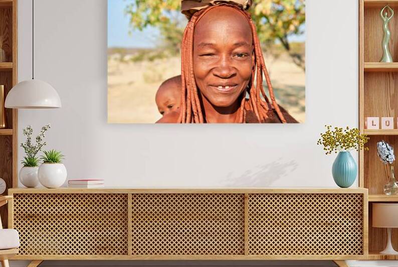 Smiling Himba woman and baby in Kunene region of Namibia by Marco Brivio