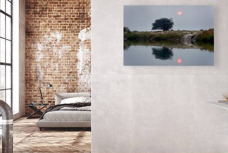 Sunset over Okavango river banks in Namibia by Marco Brivio