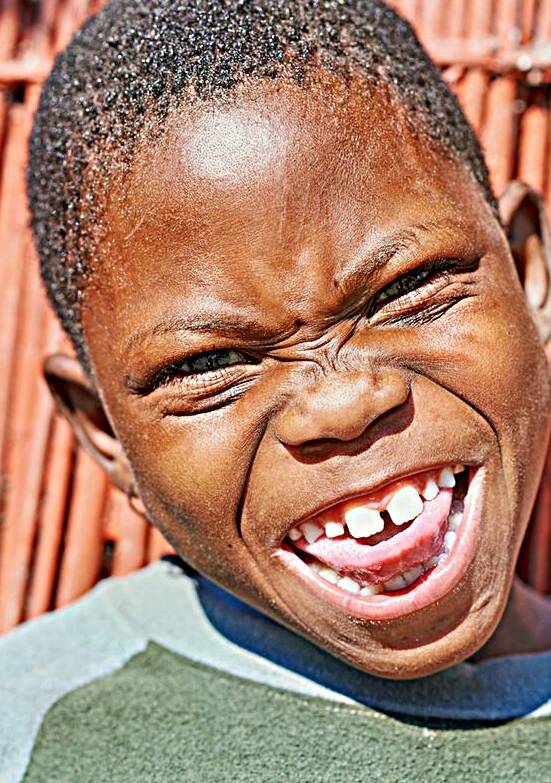Joyful child smiles in Kavango Region of Namibia by Marco Brivio