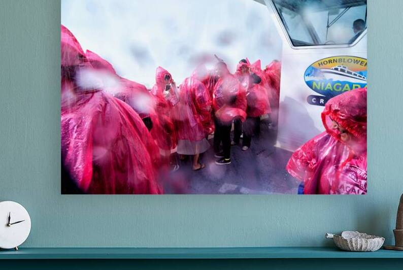 Pink ponchoed tourists on a misty Hornblower Niagara Falls cruis by Marco Brivio