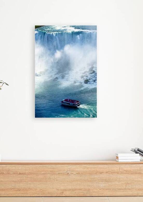 Tourists on a boat near Niagara Falls. by Marco Brivio