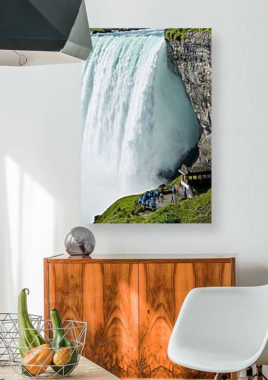 Tourists in blue ponchos at Niagara Falls. by Marco Brivio