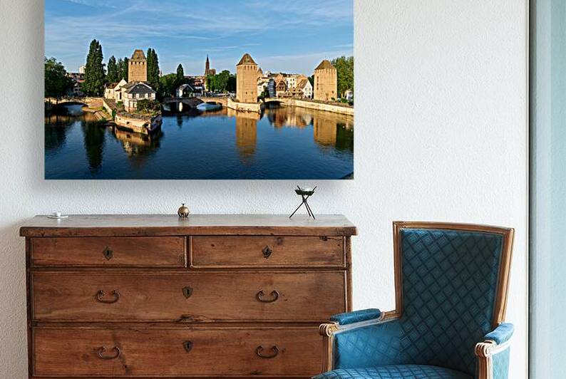 Covered bridges in Strasbourg by the river on a clear day by Marco Brivio