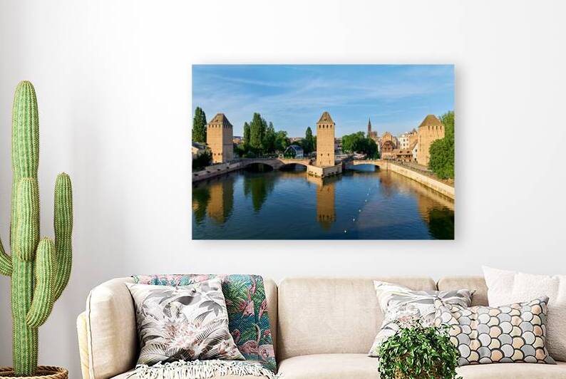 Covered bridges connect towers over water in Strasbourg Alsace by Marco Brivio