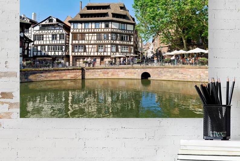 Colored timber houses by the water in Petit France district by Marco Brivio