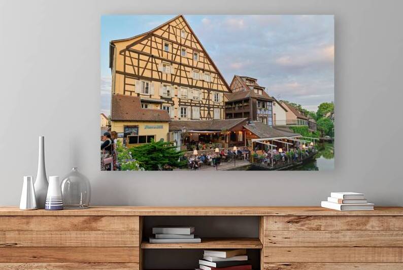 Dining by the canal in Colmar with timber framed houses in view by Marco Brivio