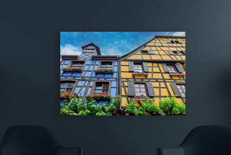 Visitors enjoy colorful timber framed houses in Riquewihr by Marco Brivio