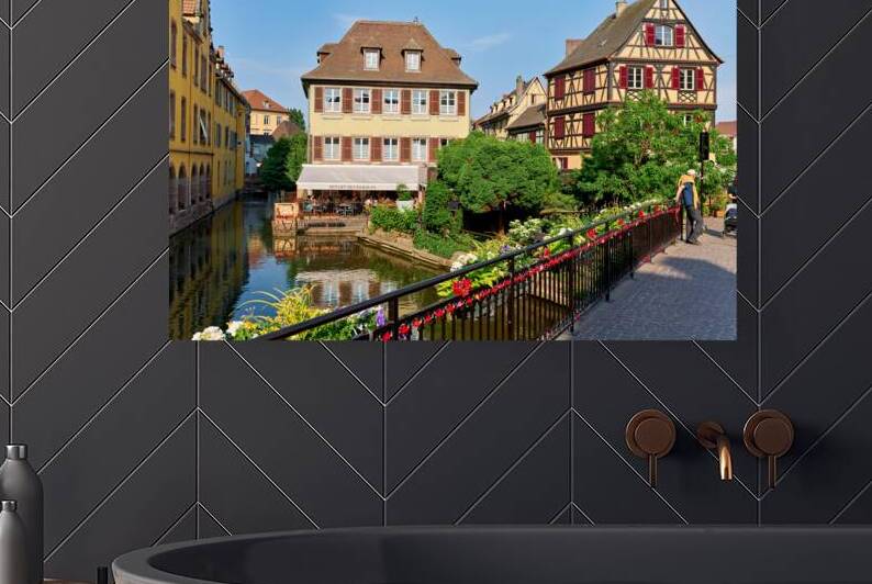 Visitors stroll by timber framed houses along the canal in Colma by Marco Brivio