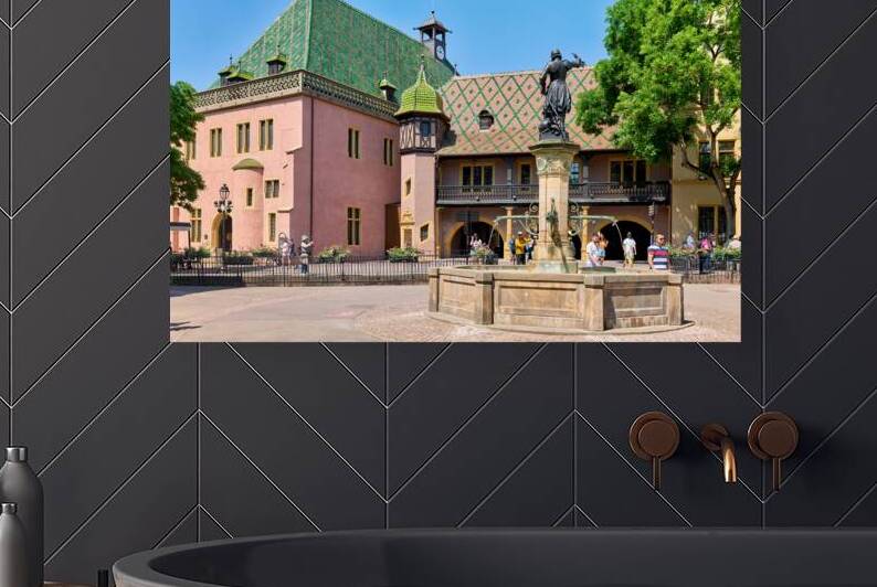 Visitors explore the square at Koifhus in Colmar Alsace France by Marco Brivio