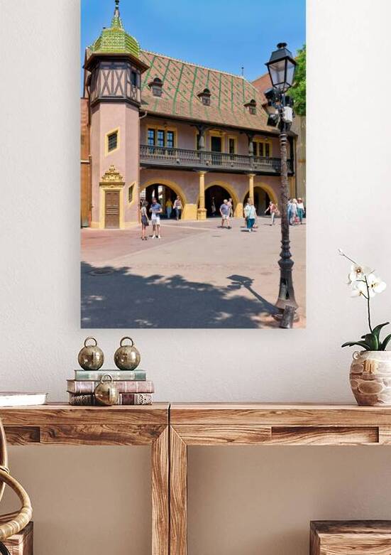 Visitors walk near the historic Koifhus house in Colmar on a sun by Marco Brivio