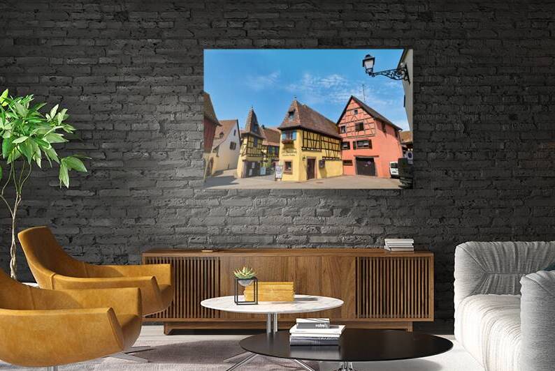 Visitors stroll through the streets of Eguisheim in Alsace by Marco Brivio