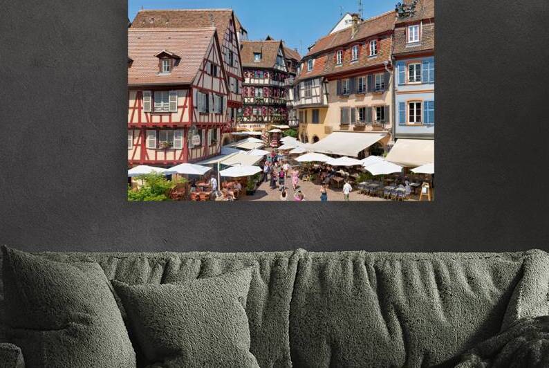 Visitors enjoy outdoor dining in Colmar on a sunny day in Alsace by Marco Brivio