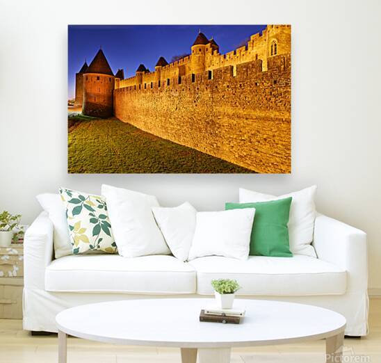 Exploring the ancient walls of Carcassonne in France at twilight by Marco Brivio
