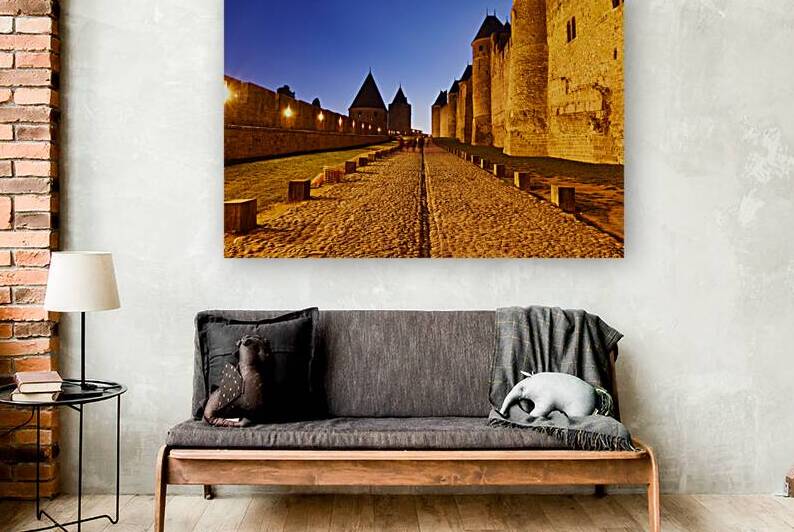 Explore Carcassonne at night with its old walls and pathway by Marco Brivio