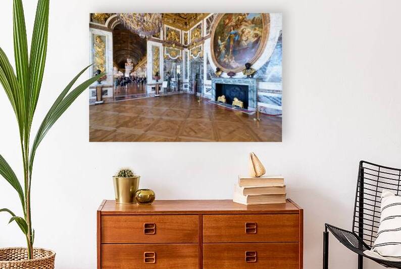 Visitors explore the halls of the Palace of Versailles in France by Marco Brivio