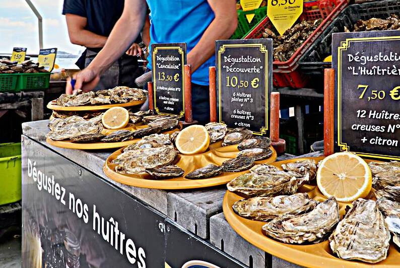 Oyster market in Cancale Brittany offers fresh seafood experienc by Marco Brivio