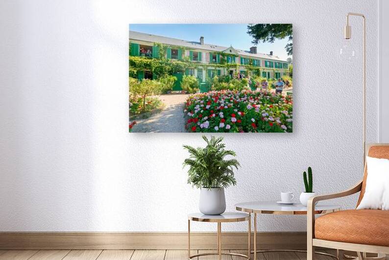Visitors admire Monets house and garden in Giverny Normandy Fra by Marco Brivio