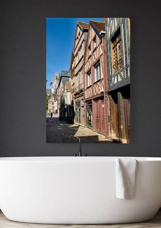 Timber houses line the street in Rouen Normandy France on a sunn by Marco Brivio