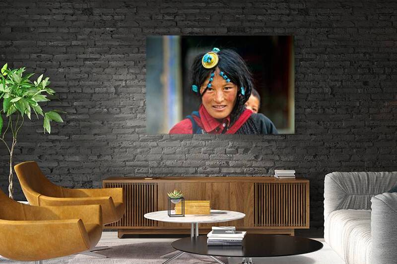 Traditional woman carries child in Tibet with ornate hair decora by Marco Brivio