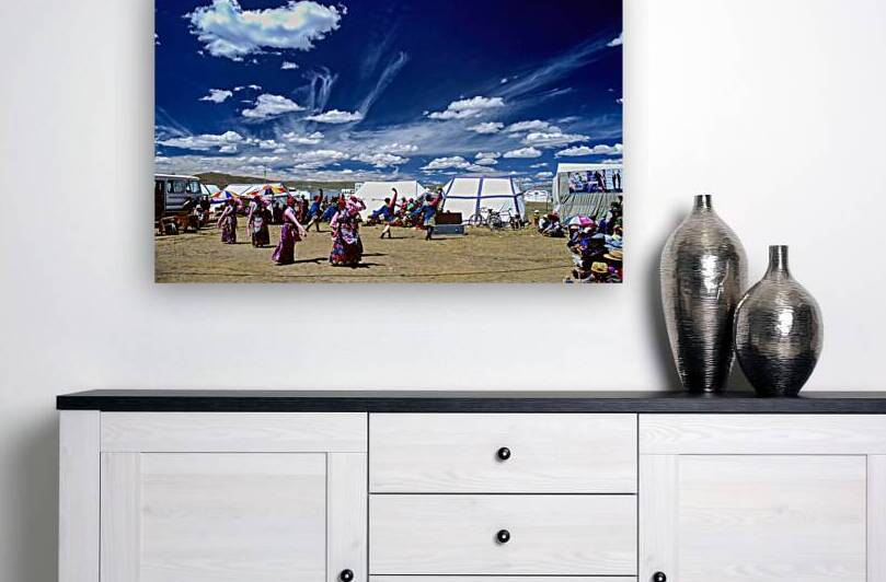 Outdoor festival in Tibet with traditional dancing and tents by Marco Brivio