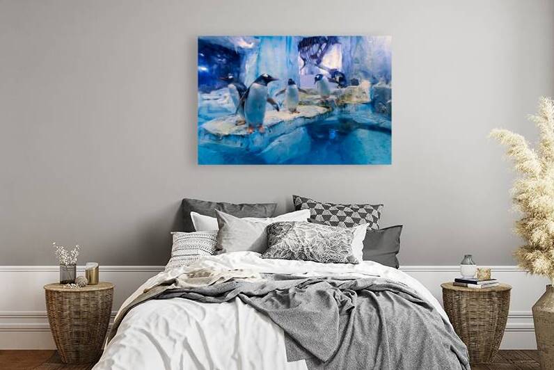 Penguins play on ice near water with a skeleton exhibit in Dubai by Marco Brivio