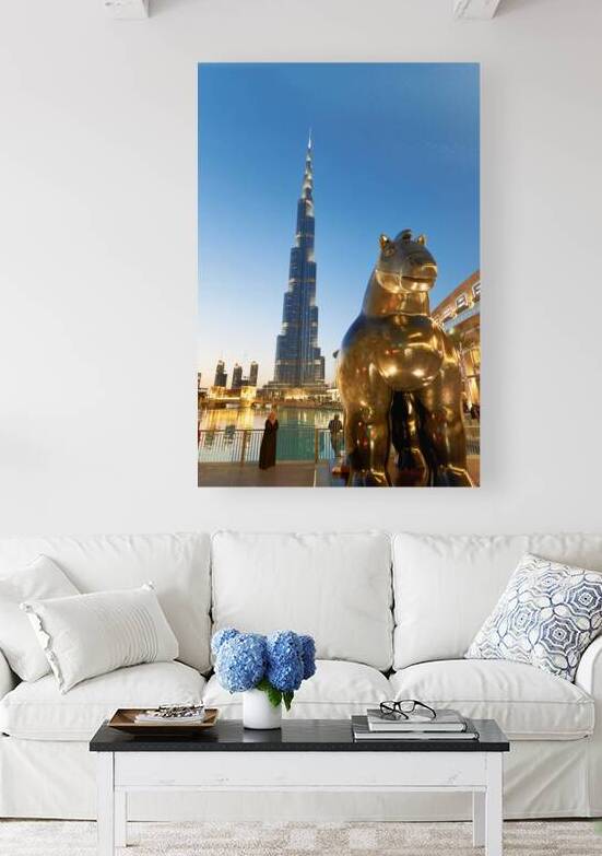 Burj Khalifa and golden horse statue at dusk in Dubai by Marco Brivio