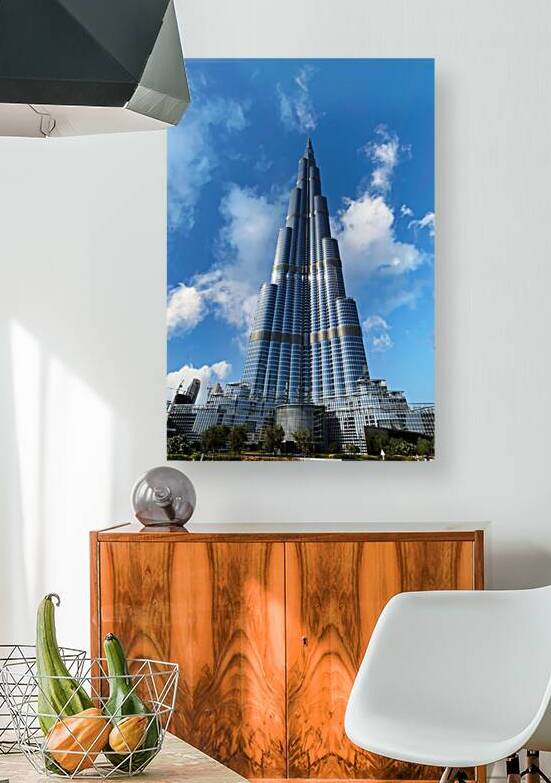 Burj Khalifa stands tall against a blue sky in Dubai UAE by Marco Brivio