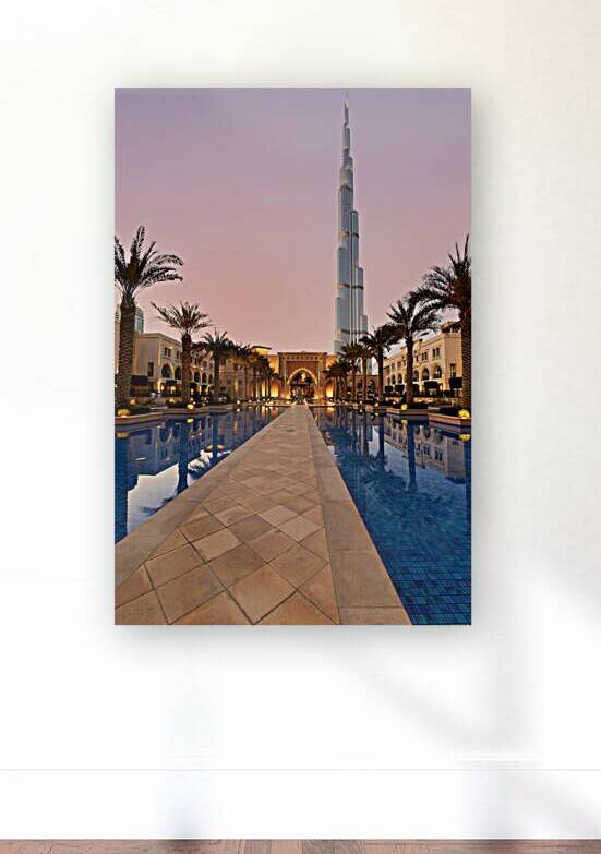 Burj Khalifa towers over pool and traditional buildings in Dubai by Marco Brivio