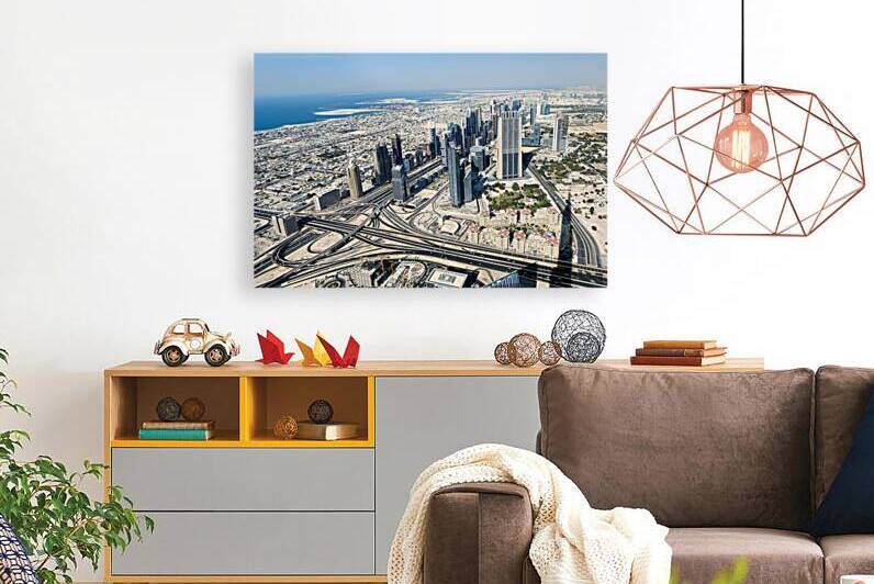 Panoramic aerial view of Dubais skyline and coastline from abov by Marco Brivio