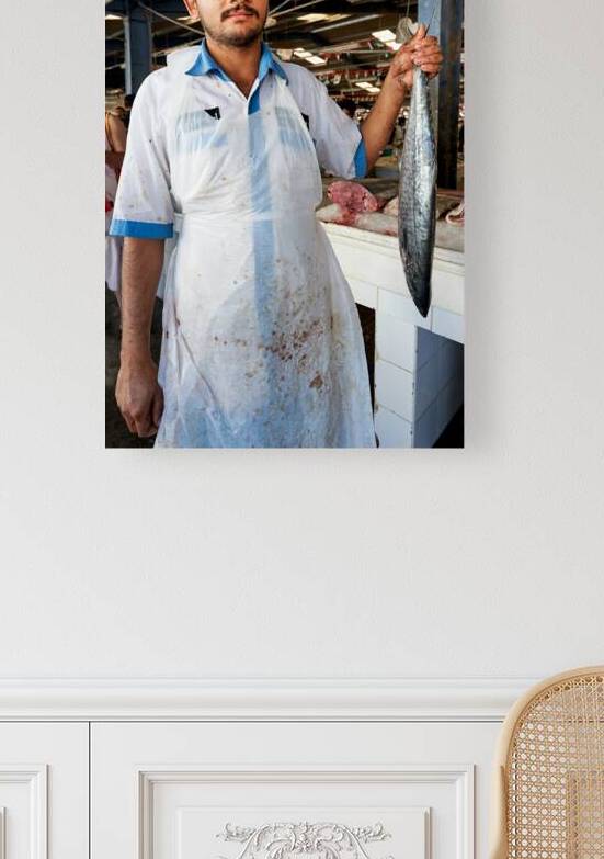 Fish vendor displays his catch at market in Dubai UAE by Marco Brivio