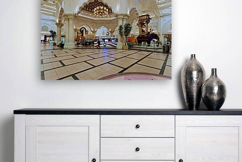 Dubai mall has cafes shops and an elephant statue by Marco Brivio