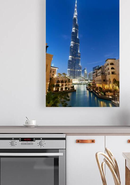 Burj Khalifa and Dubai canal light up night sky in Dubai UAE by Marco Brivio