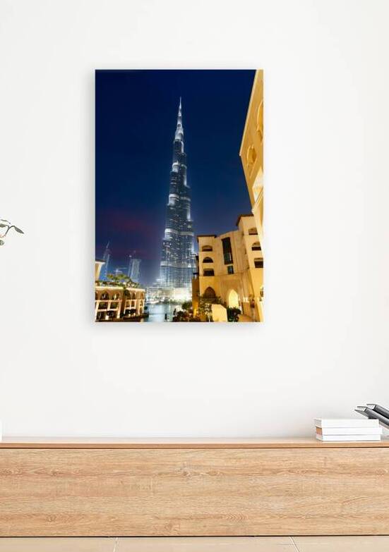 Burj Khalifa shining bright at night in Dubai UAE by Marco Brivio