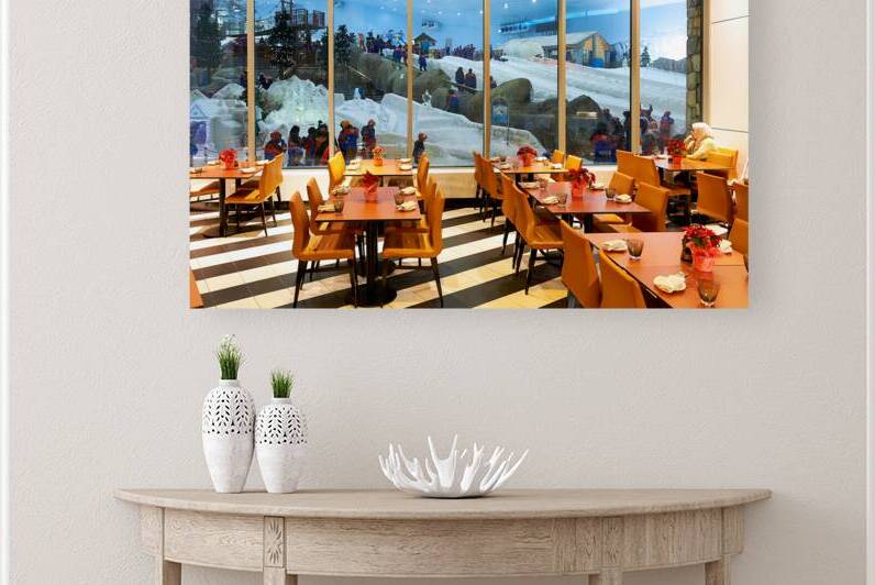 Restaurant offers view of snow activities at indoor park in Duba by Marco Brivio