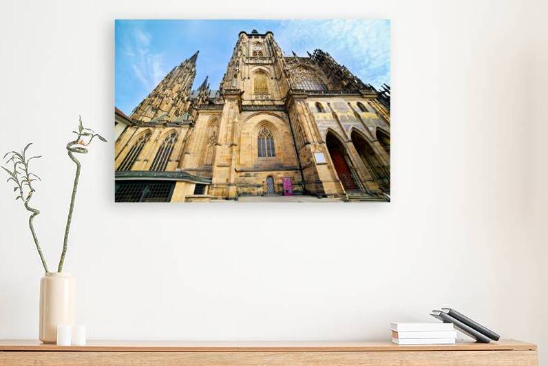 Ornate St. Vitus Cathedral facade against a blue sky. by Marco Brivio