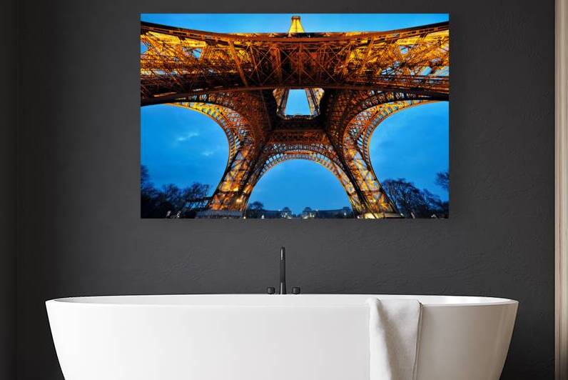 View of Eiffel Tower structure from below at dusk in Paris Fran by Marco Brivio