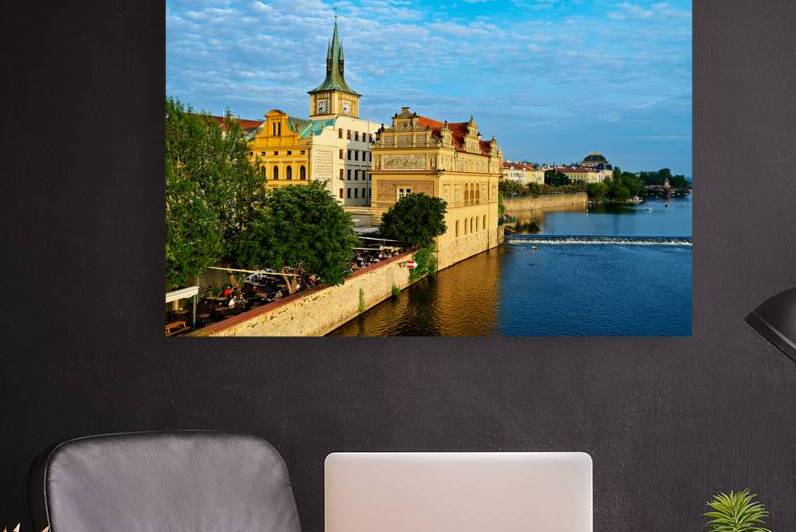 Pragues Vltava riverfront with historic architecture and lively by Marco Brivio