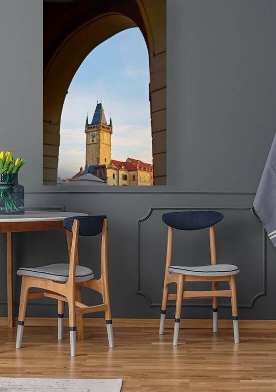 Historic clock tower framed by an archway. by Marco Brivio