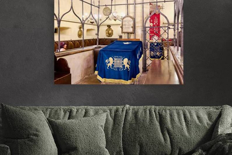 Ancient synagogue interior with ornate blue velvet Torah cover. by Marco Brivio