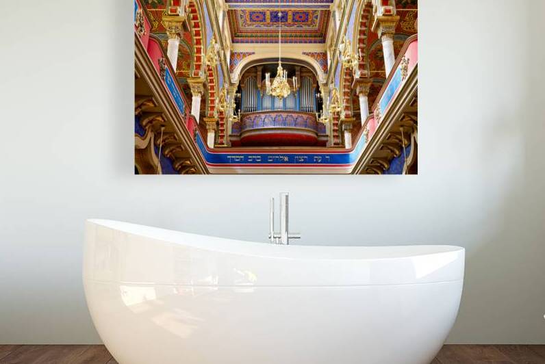 Ornate synagogue interior with organ and chandeliers. by Marco Brivio