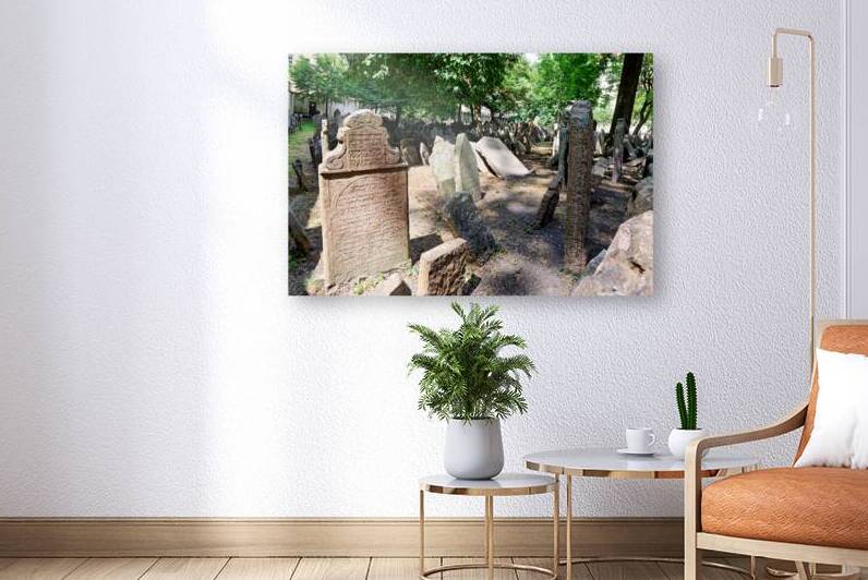 Ancient Jewish cemetery with weathered gravestones and trees. by Marco Brivio