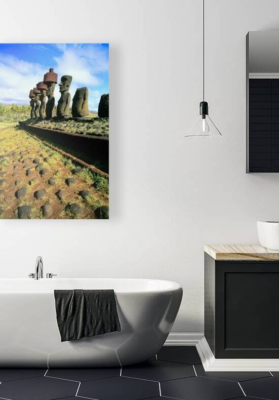 Ancient Moai statues stand tall on Easter Island. by Marco Brivio